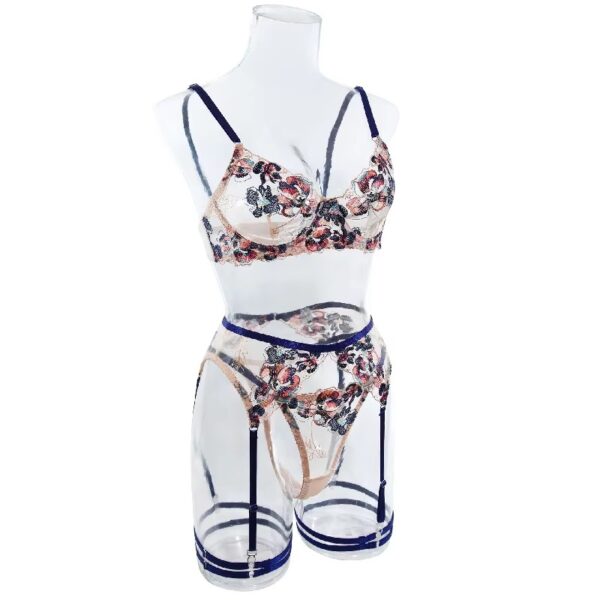 Side view of a floral embroidered lingerie set with blue trim, displayed on a mannequin to emphasize the bold and sensual design.