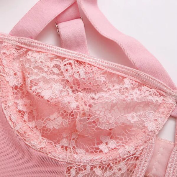 Close-up of the cups of the pink bodysuit, emphasizing the romantic design and delicate details.