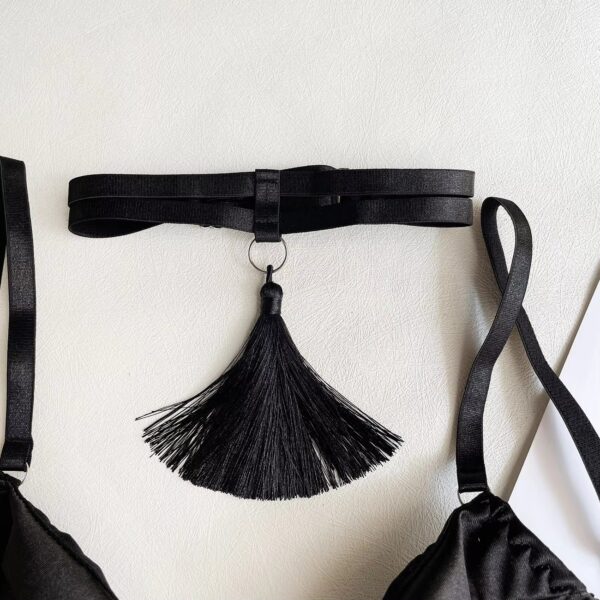 Close-up of the black collar, showcasing its sensual and mysterious design as part of the lingerie set.