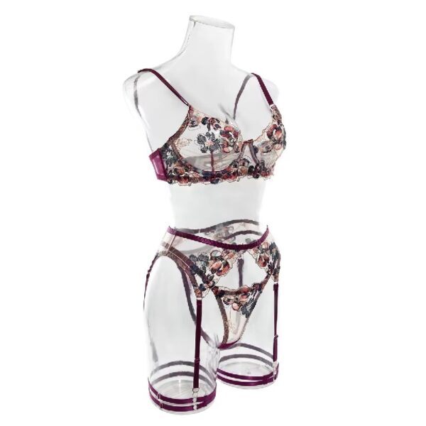 Side view of a floral embroidered lingerie set with purple trim, displayed on a mannequin to highlight the playful and seductive design.