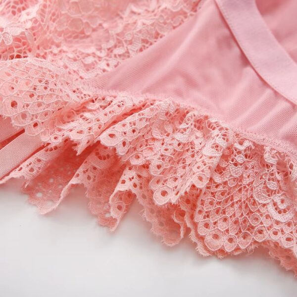 Close-up of the frills on the pink bodysuit, adding a sweet and romantic touch to the lingerie set.