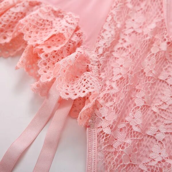 Close-up of the frills on the pink bodysuit, emphasizing the romantic and sweet design with delicate fabric details.