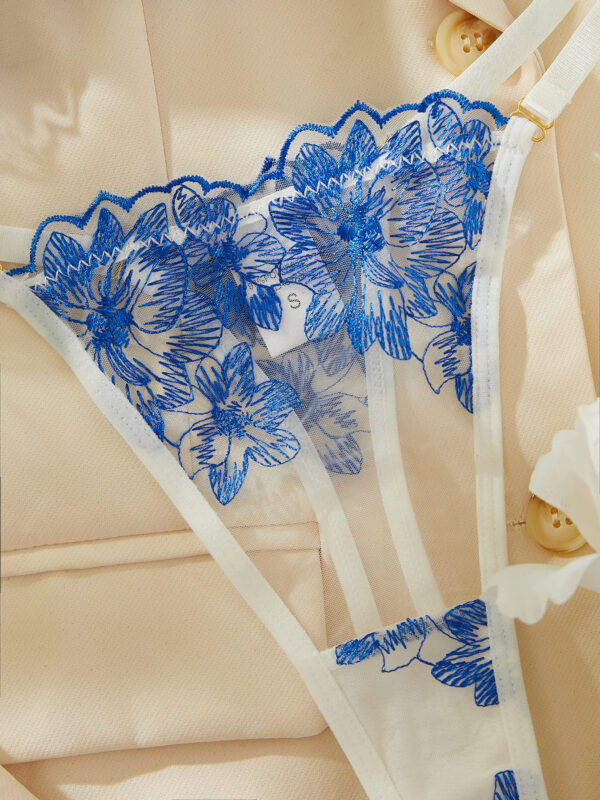 Close-up of the floral embroidered thong, featuring delicate lace and a refined design that complements the set.